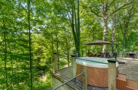 Main living area with balcony and views of New Buffalo waterfront